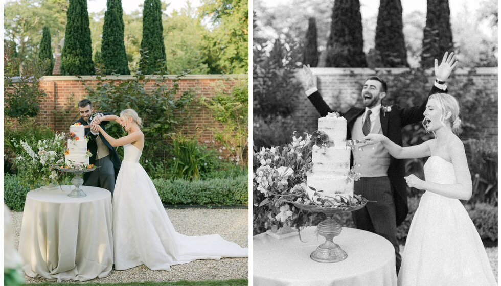 Bride and groom cutting tiered wedding cake adorned with flowers in Hampshire country house garden.