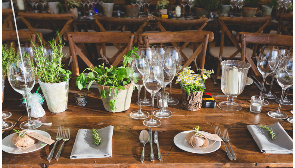 The natural flower arrangements on the tables at the recepetion