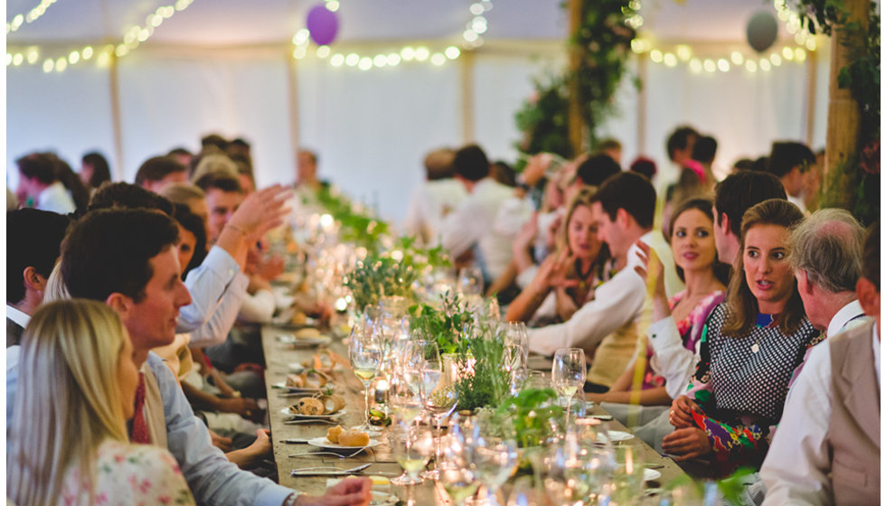 Guests enjoy the food and wine at dinner.