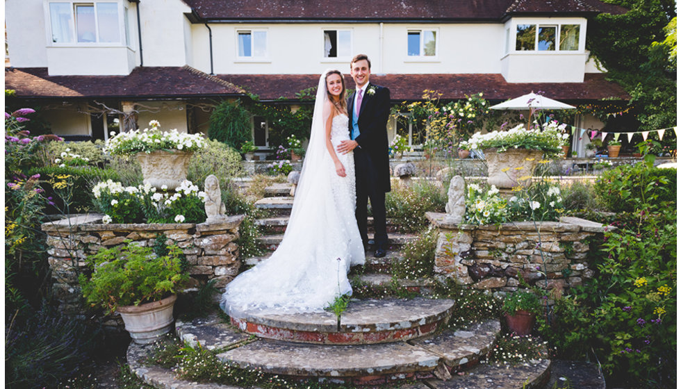 Daisy and Charlie pose in front of Daisy's house in Sussex.