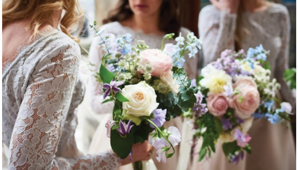 The bridesmaids holding the bouquets