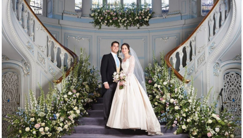 The wonderful staircase display of flowers at the reception