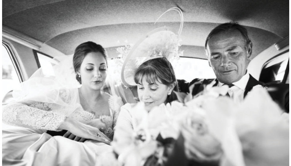 Daisy and her parents in the car on the way to the church