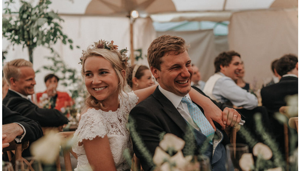 Harriett and Ed share a moment together looking relaxed during their speeches.