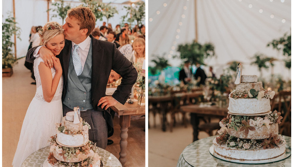 The bride and groom about to cut their cheese cake.