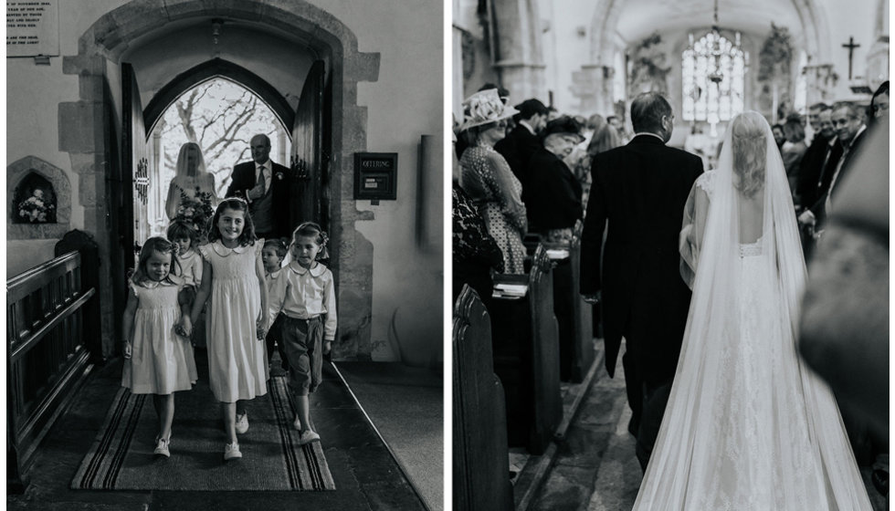 Harriet walking down the aisle with her page boys, flower girls and maid of honour behind her.