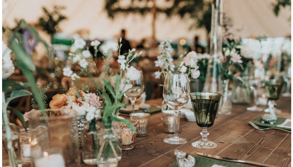 Flowers on the tables in the marquee.