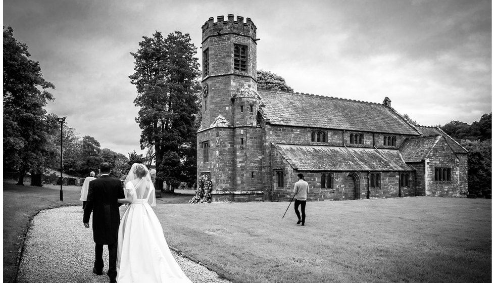 Min and her dad walk up to the church. 