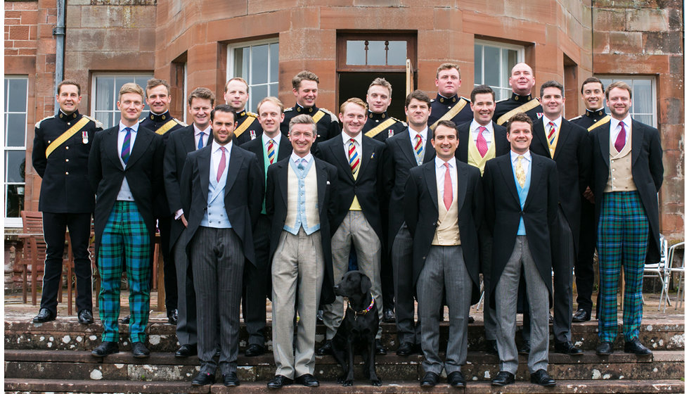 Duncan and his ushers posing on some steps.