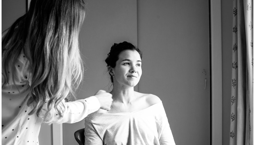 Min having her make up done by a close friend. 