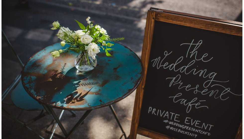 Chalkboards with Caligraphy on by ERA calligraphy and flowers on the tables by Mad Lillies.