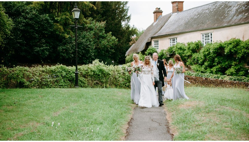 Poppy and her bridesmaids arrive at the church