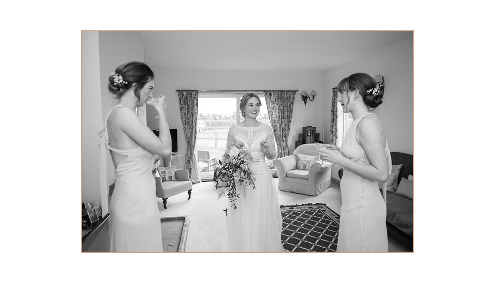 The bride and her bridesmaids enjoying a glass of champagne before the wedding.