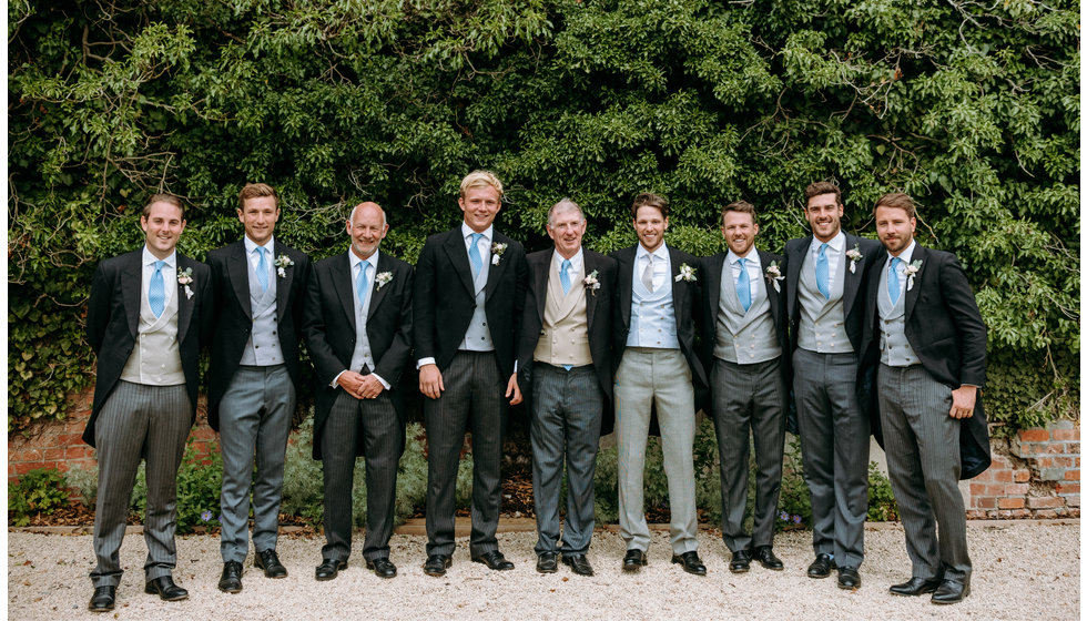 The groom surrounded by his ushers.