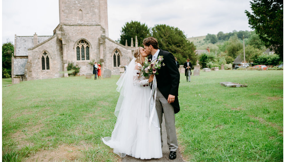 Poppy and Jamie kiss outside the Church.