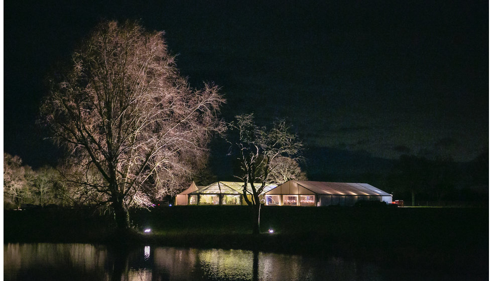 The marquee all lit up by lights. 