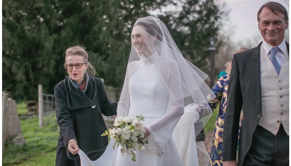 The beautiful bride in her veil about to walk into the Church. 