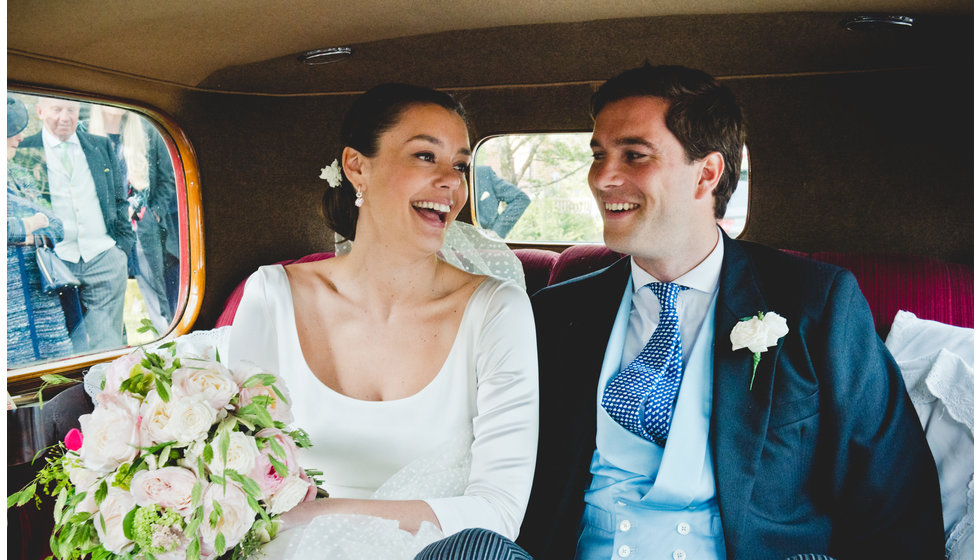 Will and Charlotte in the back of the car after they married.