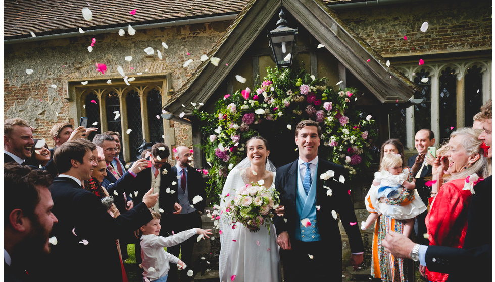 Will and Charlotte come out of the church.