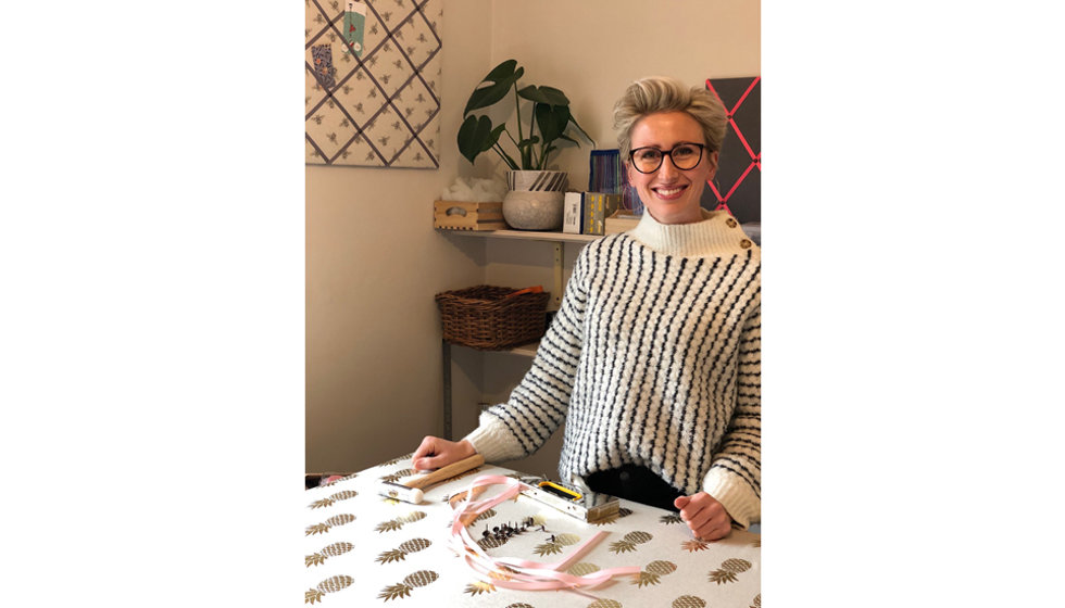 An image of Harriet making a pineapple notice board.