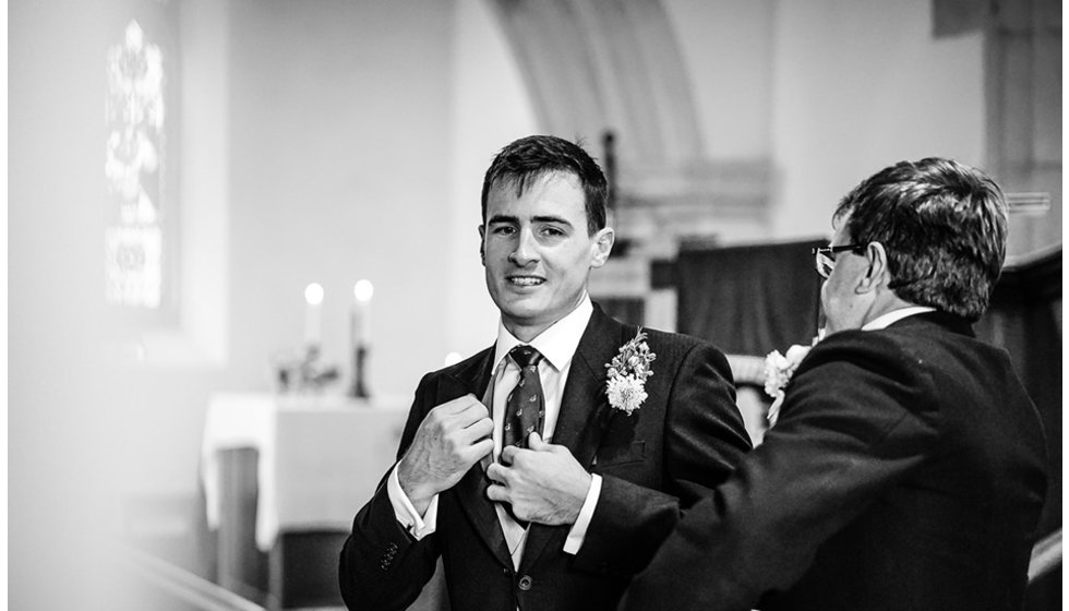 The groom Josh in the church.