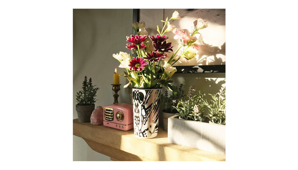 One of Bell's tumblers with fresh flowers in on the mantelpiece.