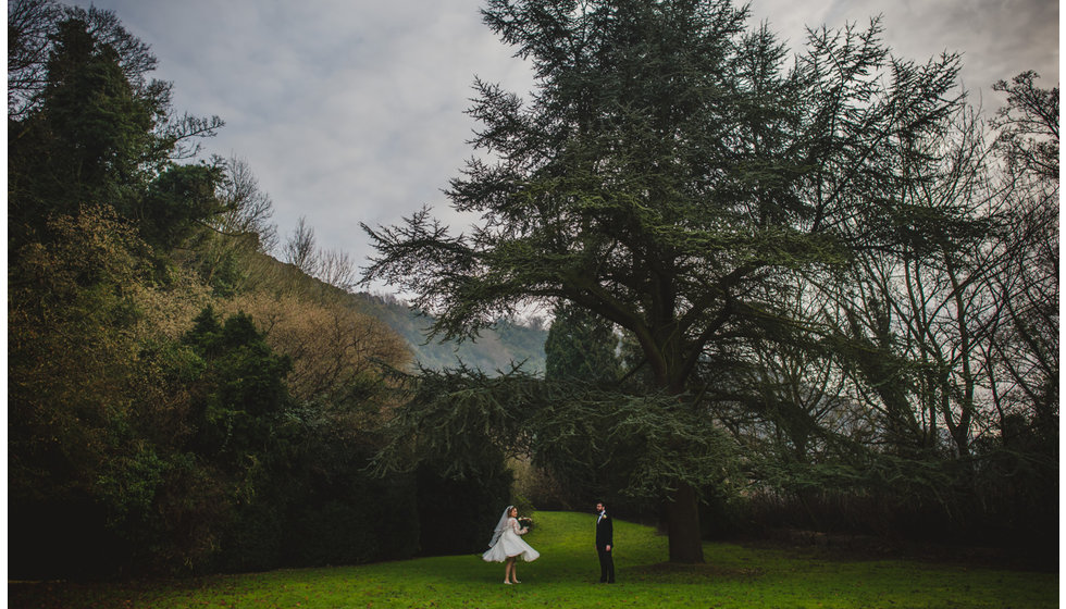 A couple outside in the winter countryside.