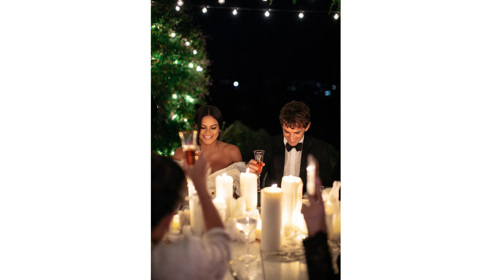 Portrait of two people with candlelight.