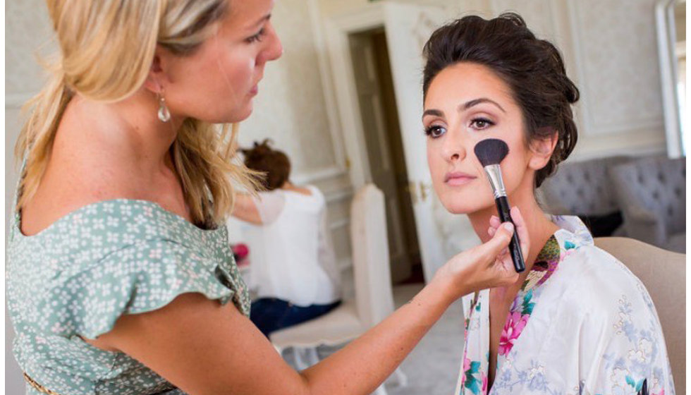 Sophie doing a make up of one of her brides.