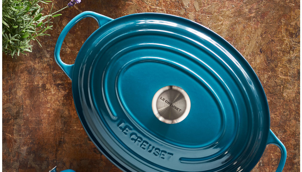 A Le Creuset Cast iron oval casserole dish in deep teal.