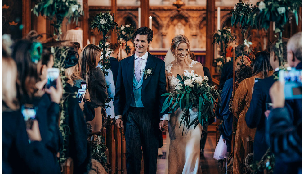 The bride and groom walking down the aisle.