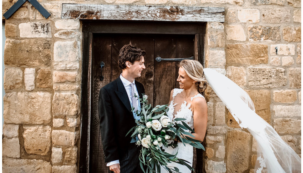 Rebecca and Sam outside their wedding venue.