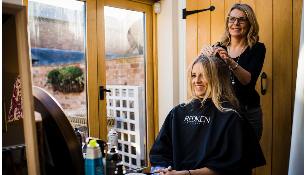 The bride having her hair done.