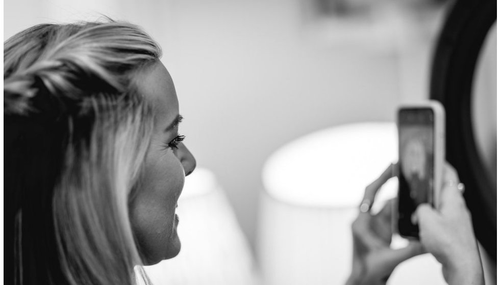 Sophie taking a photo of one of the attendees make up.