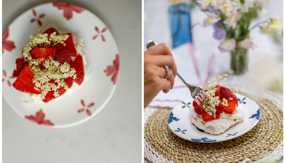 Two shots of the pavlova decorated in fresh strawberries and elderflower.