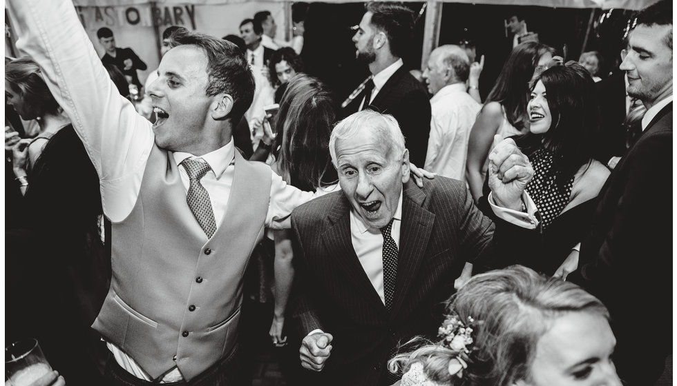 Wedding guests of all ages on the dancefloor enjoying the music