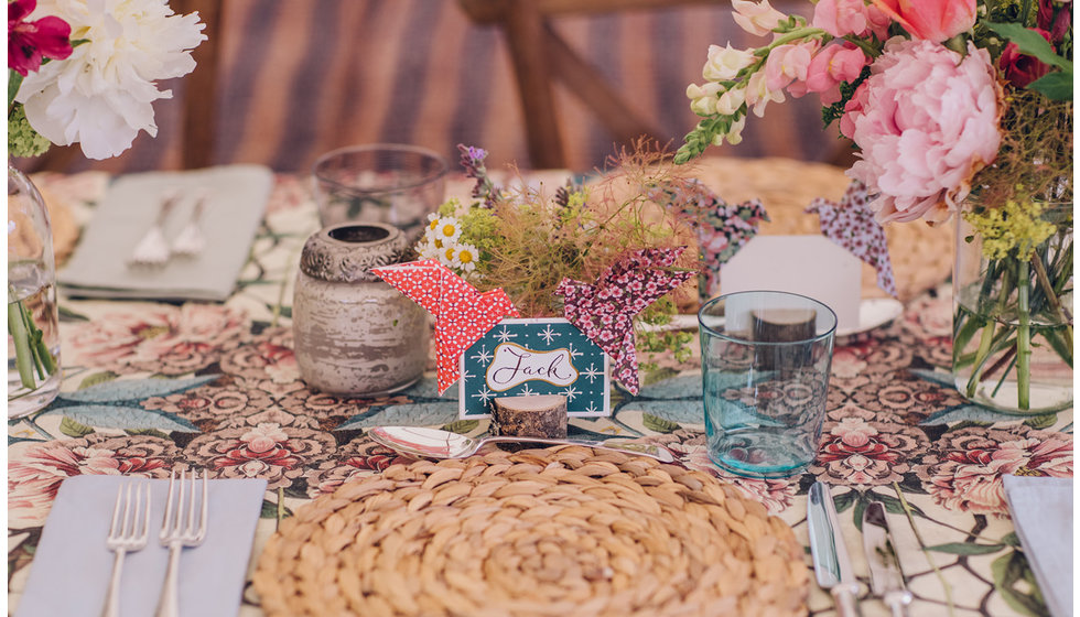 Table details, rattan placemats, colourful glassware, handpicked flowers in bud vases and hand made placenames.