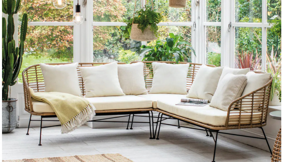 A black metal outdoor sofa from Garden Trading.