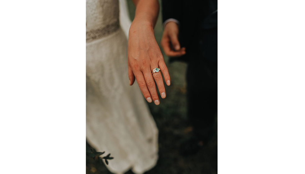 Harriet a bride showing her engagement ring and wedding ring.