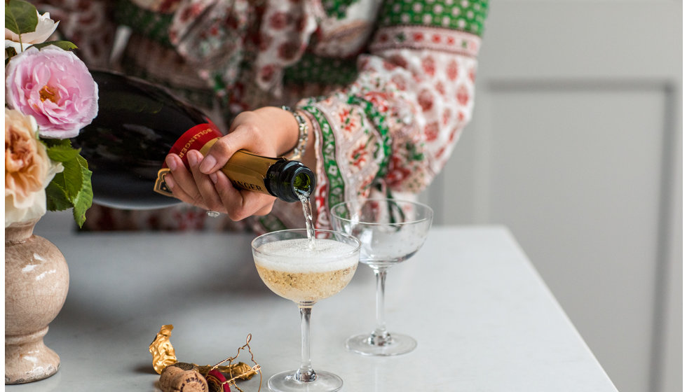 Georgie our managing director pouring a champagne into The Vintage List coupes.