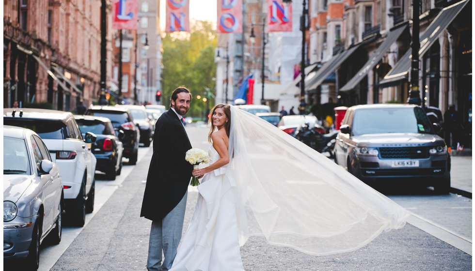 Lauren and Ed standing outside their London Venue.