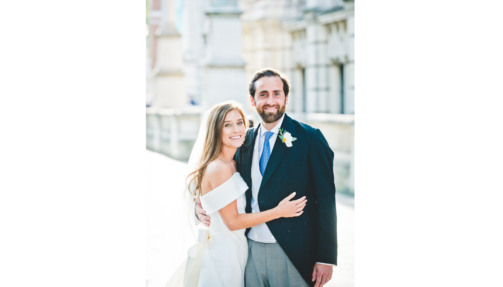 The bride and groom outside in London.