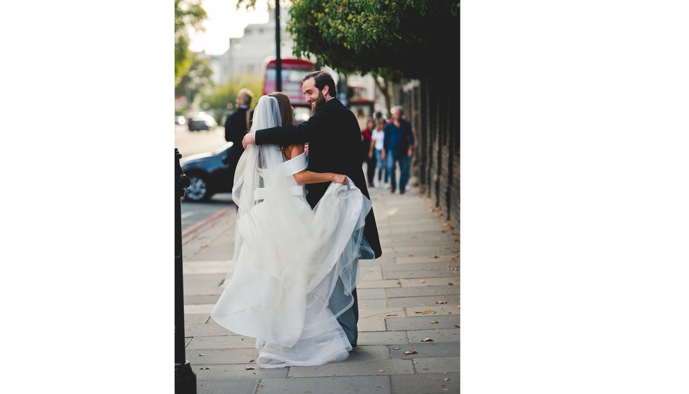 The bride and groom arm in arm after the ceremony in the Church.