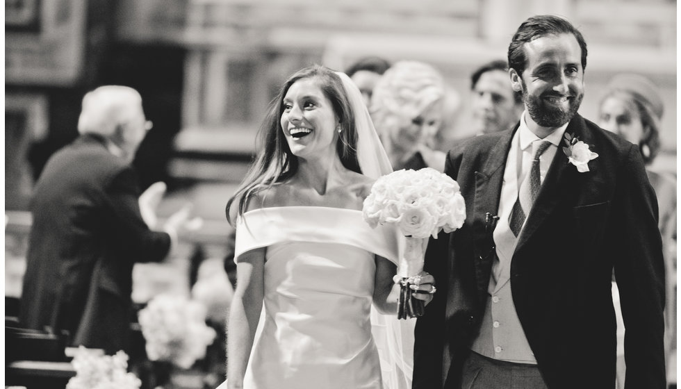 The bride and groom walking down the aisle.