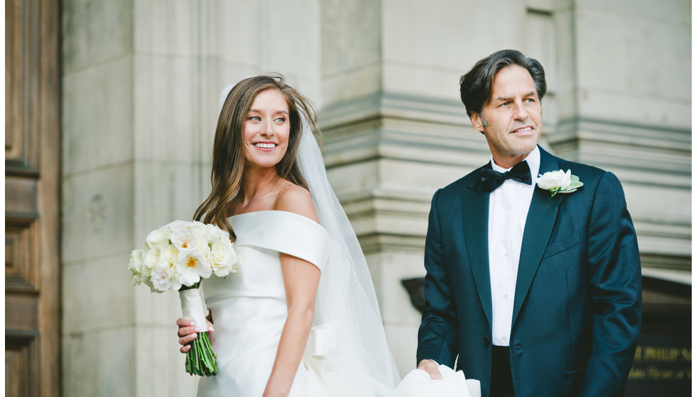 The bride and her father standing outside the Brompton Oratory.