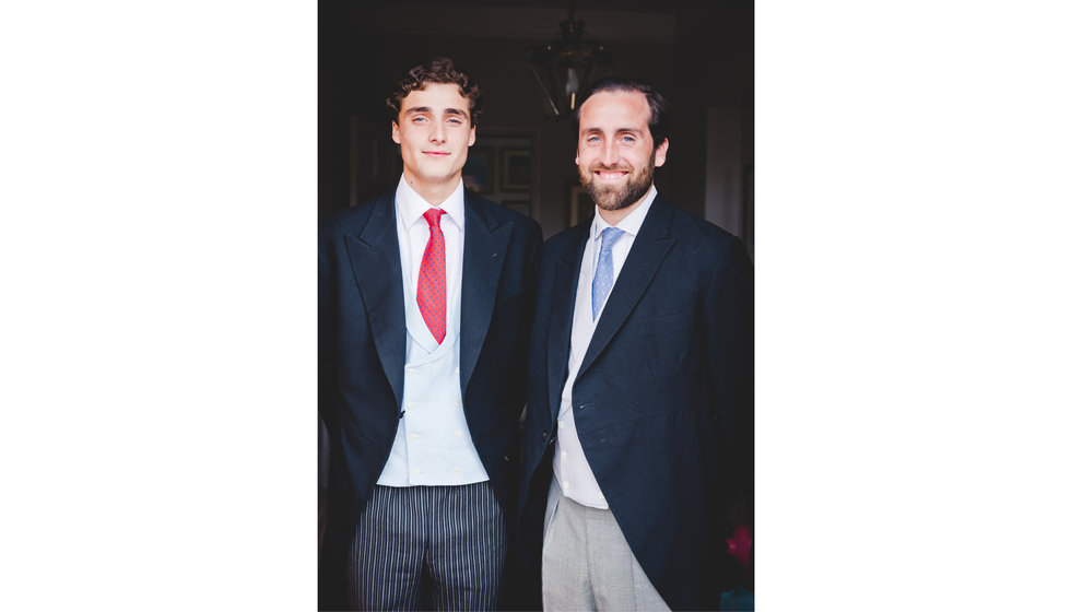 The groom and his brother wearing their morning suits.