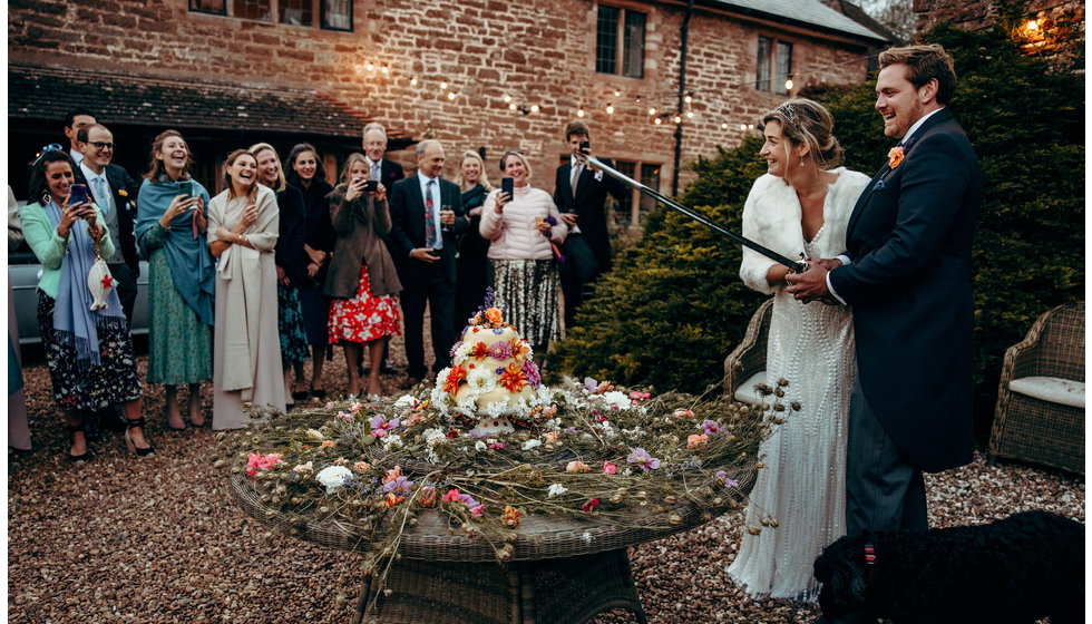 The bride and groom cutting the cake.