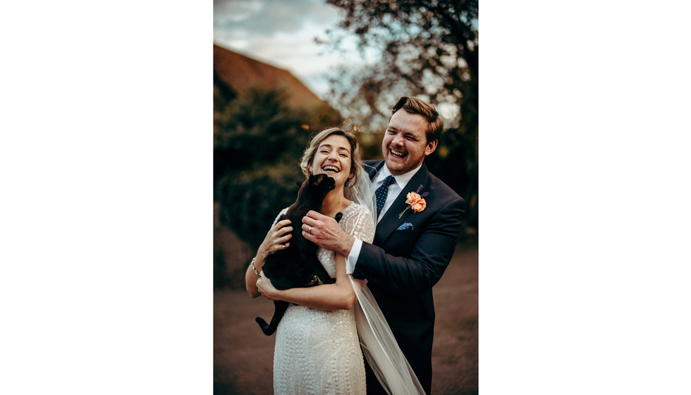 The bride and groom and the family cat.