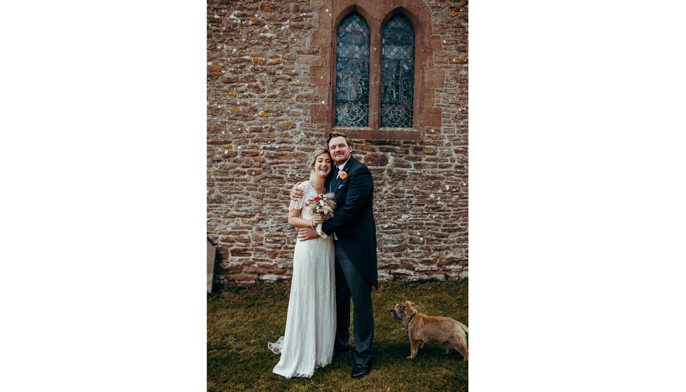 The bride and groom outside the chapel after their intimate wedding.