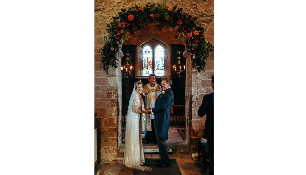 The bride and groom in the Church during their wedding ceremony.